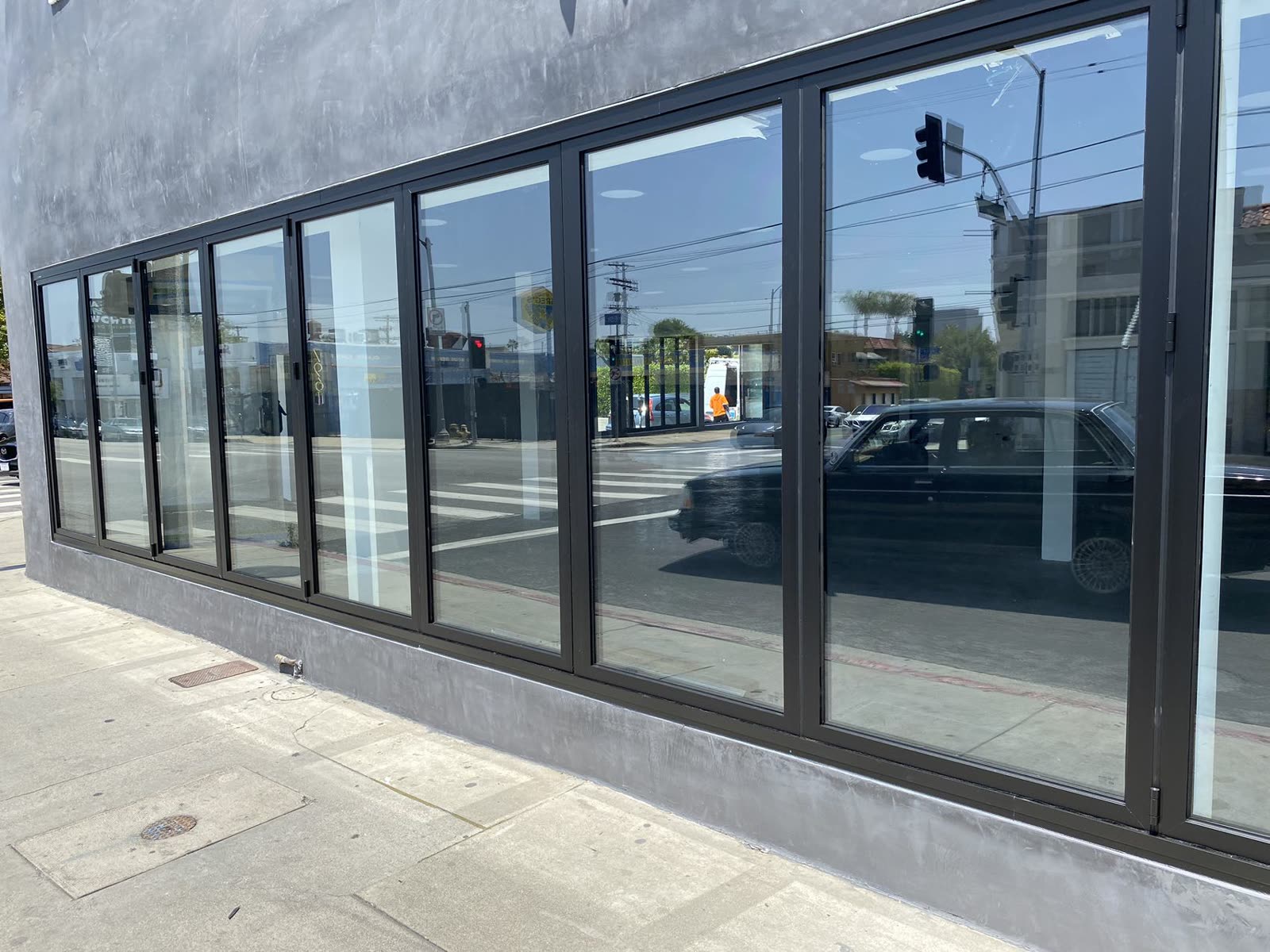 Commercial storefront folding window installation in Los Angeles