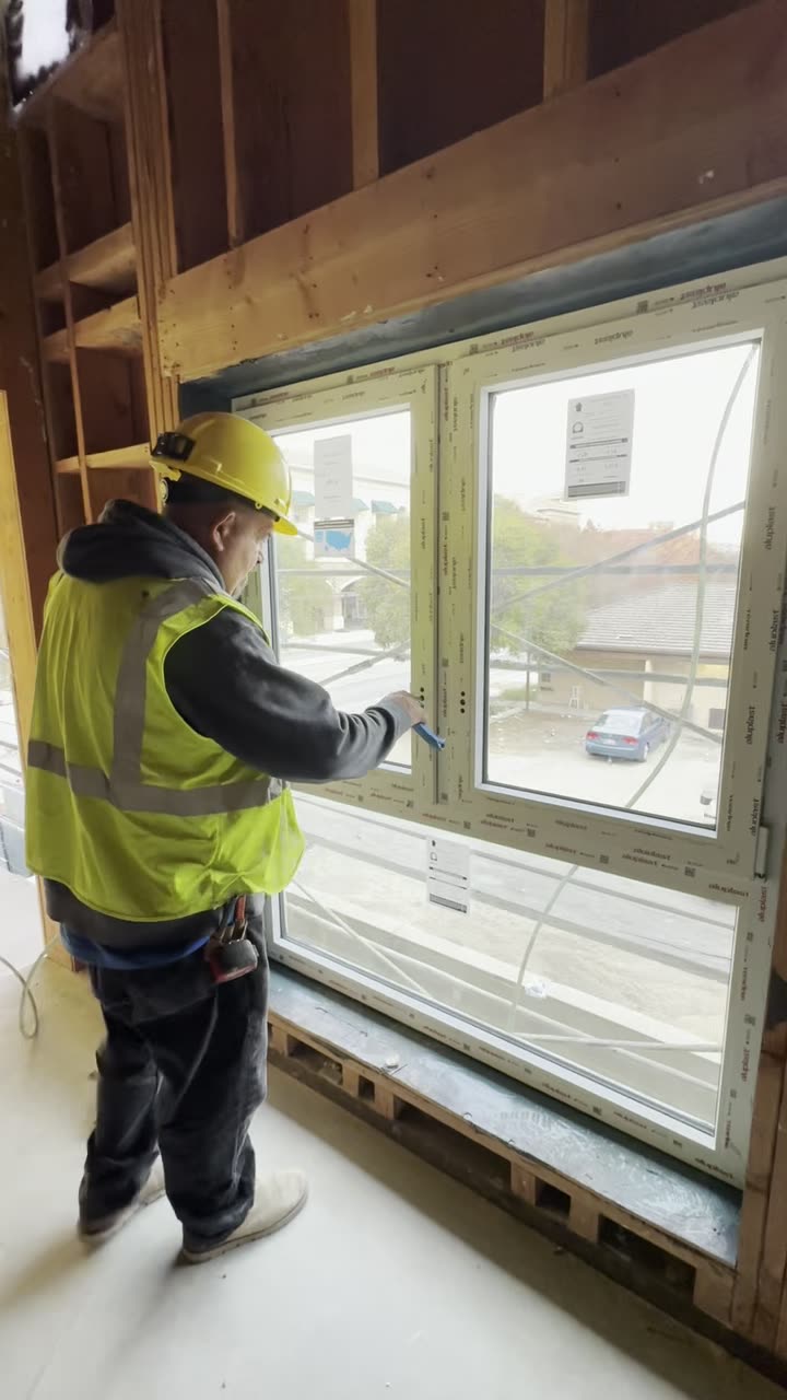 Glass technician repairing a window system in Los Angeles County